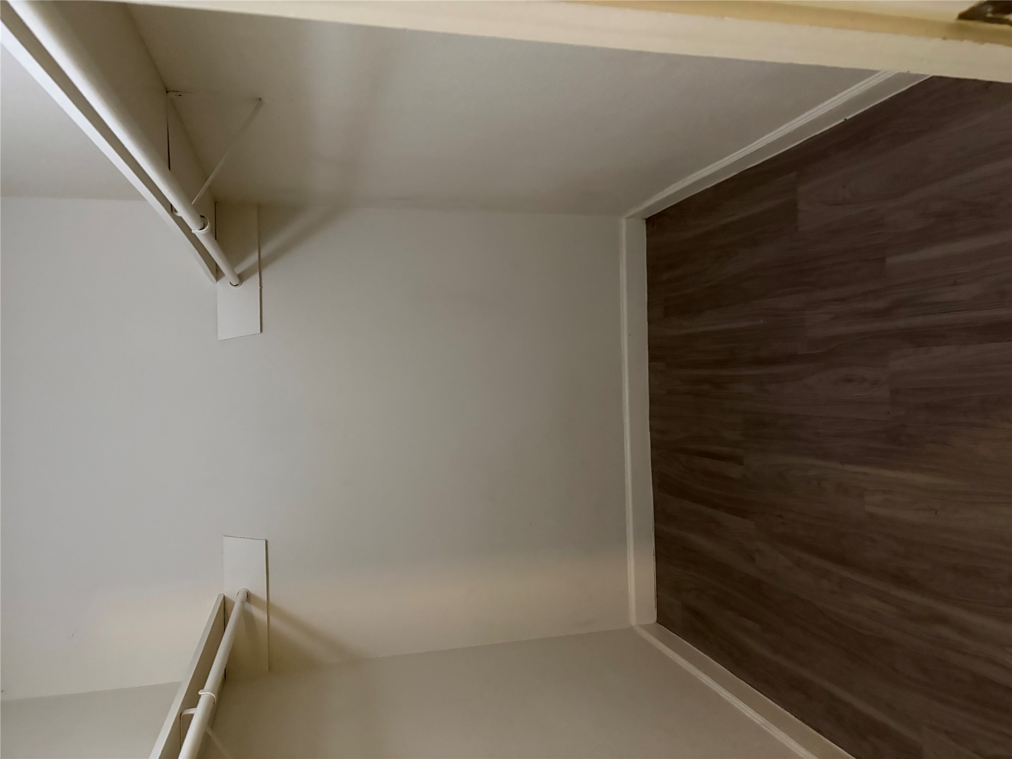 4501 Speedway, Unit 101 Austin, TX 78751 - Photo 4 of 7 Ample hanging space and durable flooring define this well-appointed walk-in closet.