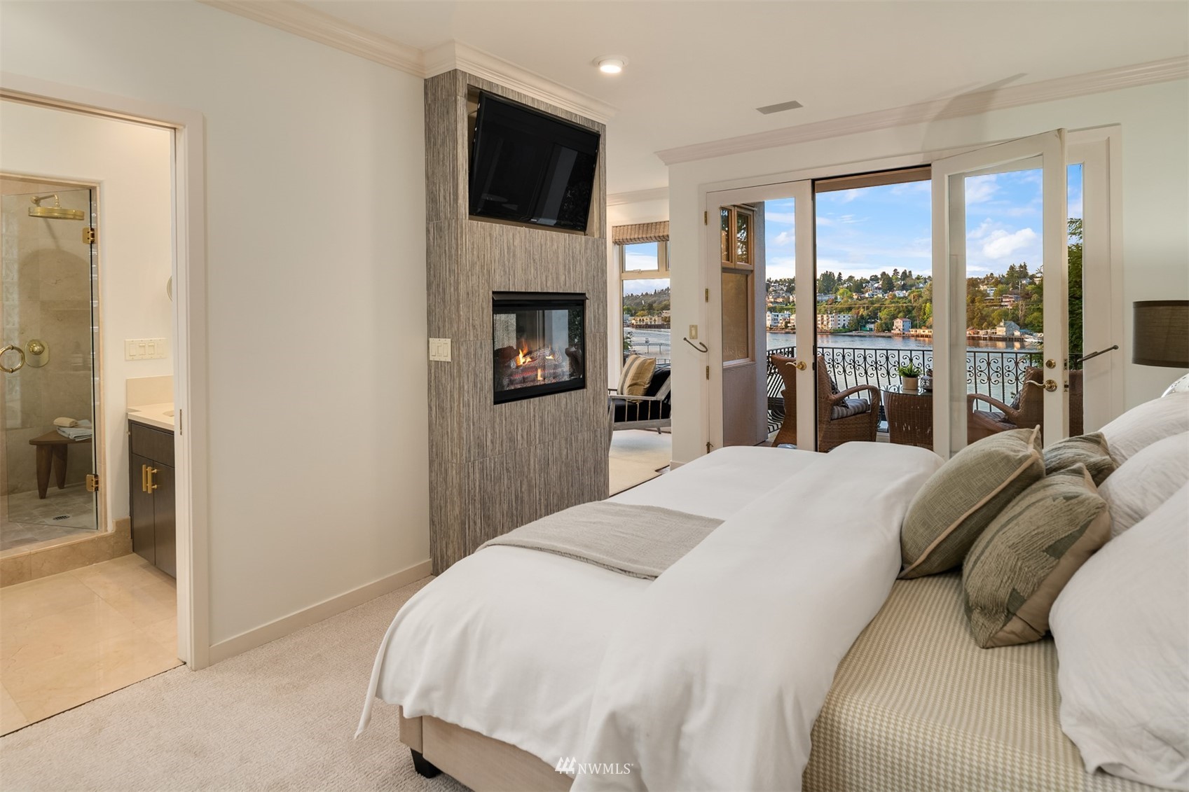 3768 West Commodore Way Seattle, WA 98199 - Photo 17 of 37 a bed room with a bed and a television