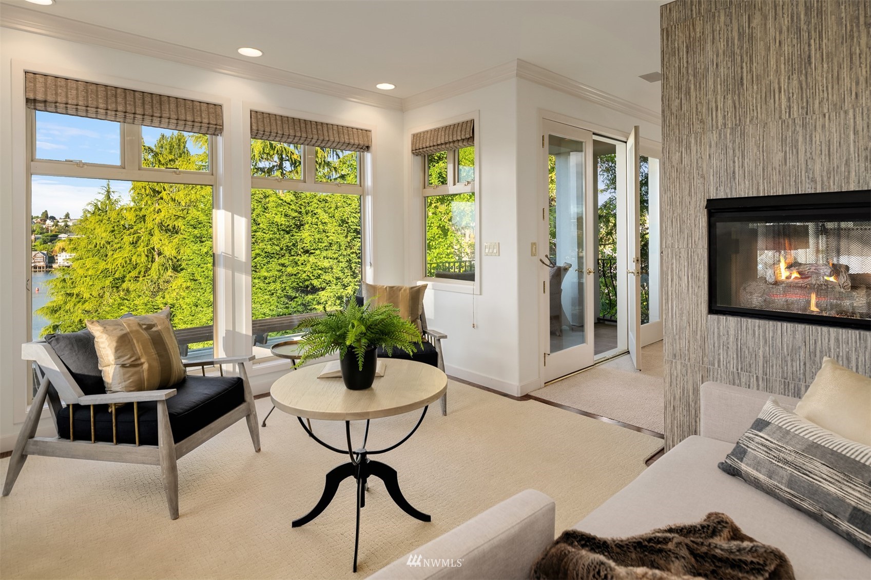 3768 West Commodore Way Seattle, WA 98199 - Photo 18 of 37 a living room with furniture and a fireplace