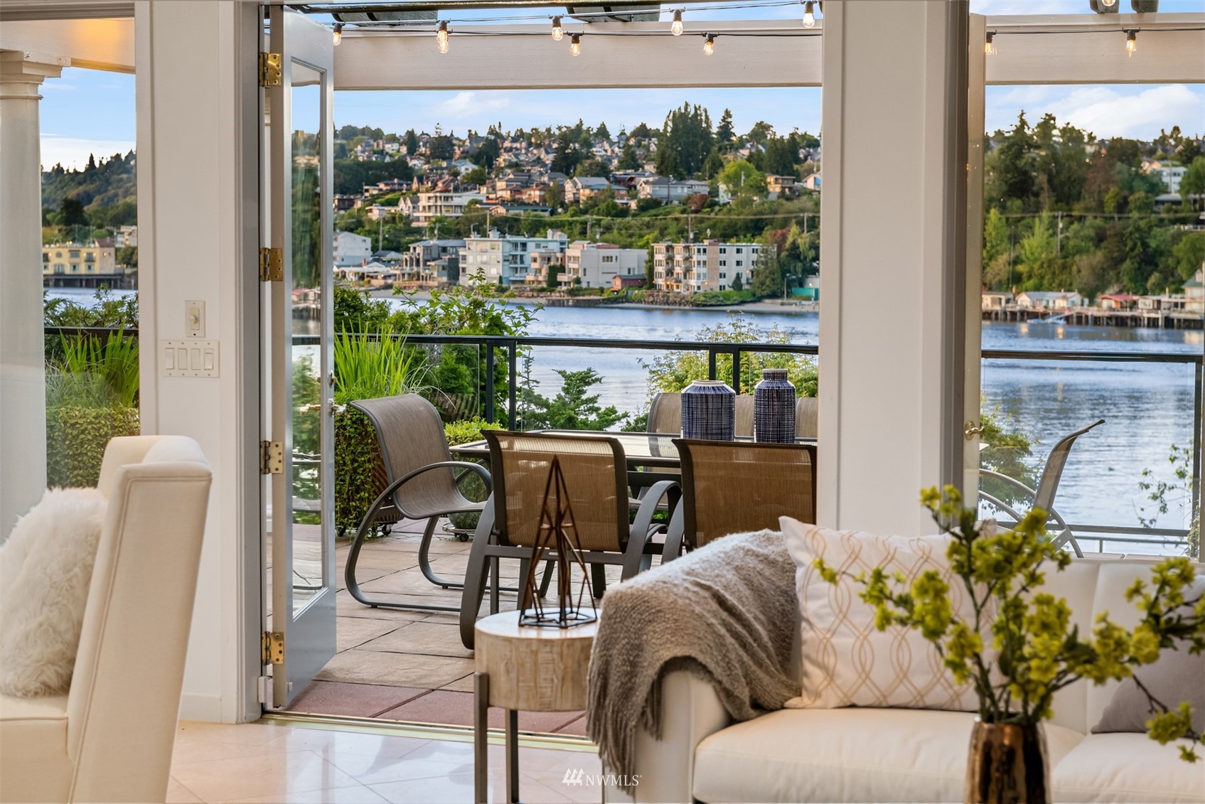 3768 West Commodore Way Seattle, WA 98199 - Photo 4 of 37 a living room with furniture a floor to ceiling window and a floor to ceiling window