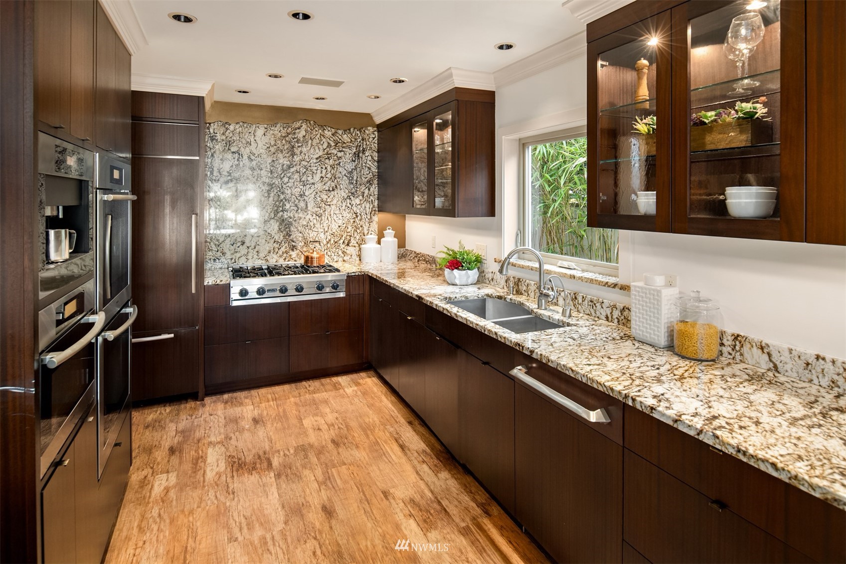 3768 West Commodore Way Seattle, WA 98199 - Photo 9 of 37 a kitchen with granite countertop a sink stove and refrigerator