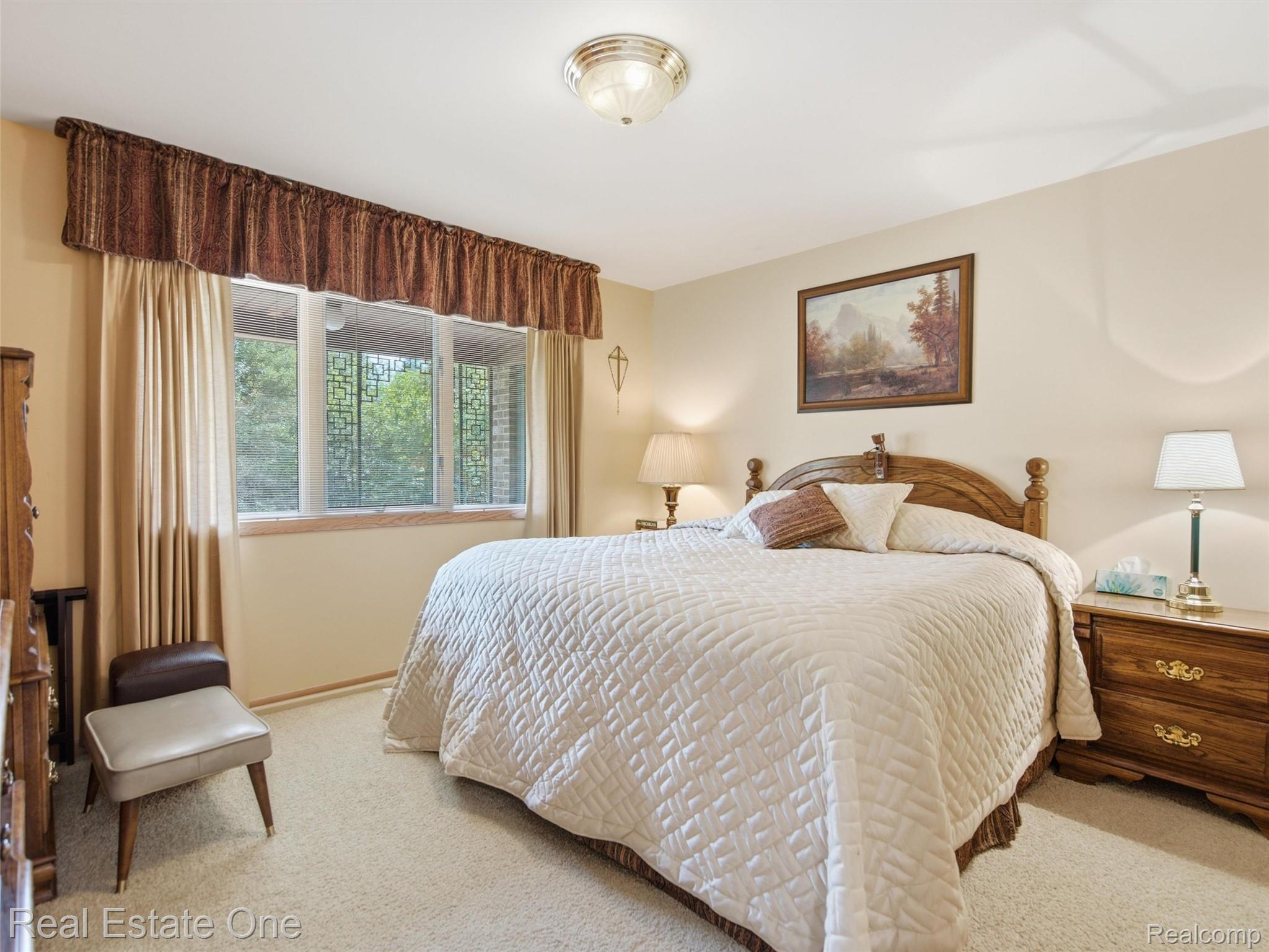 2626 West Wattles Road Troy, MI 48098 - Photo 23 of 65 Neutral-toned walls complement the light-colored carpeting
