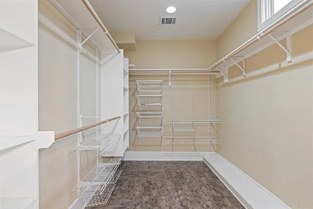 a view of an empty walk in closet