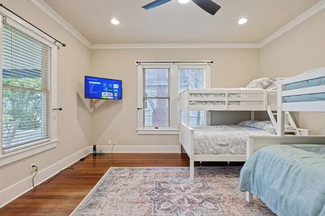 a bedroom with furniture and a fireplace