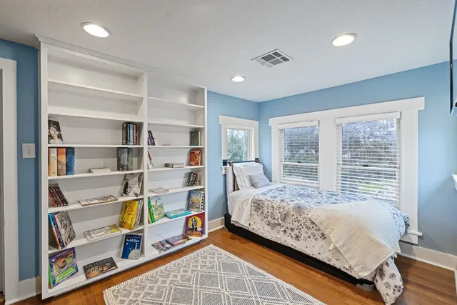 a bedroom with bed and a window