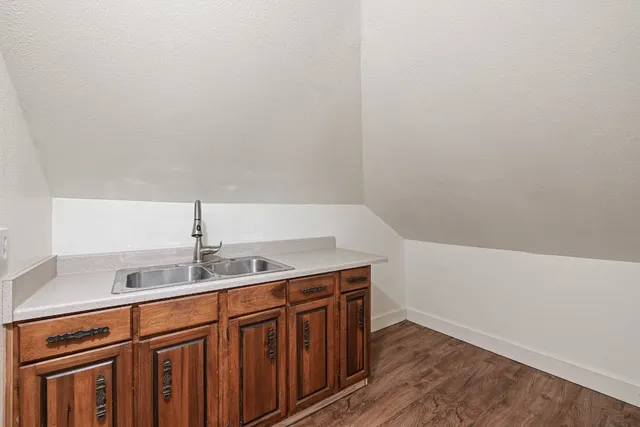 a kitchen with a sink and cabinets