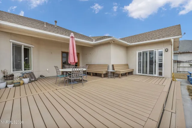 a house with swimming pool in front of it