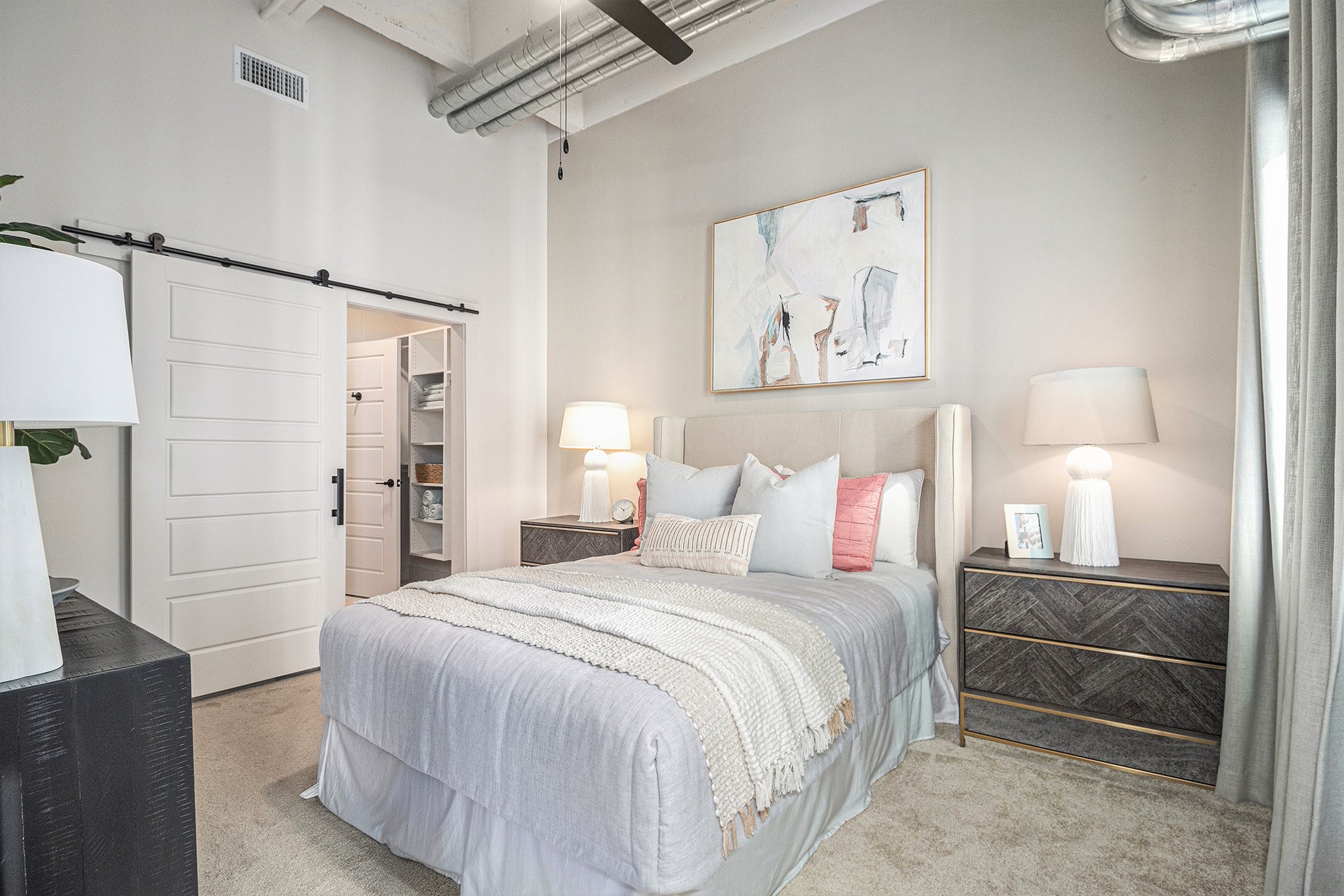 1801 Smith Street, Unit 2007 Houston, TX 77002 - Photo 8 of 25 a bedroom with a bed and a walk in closet