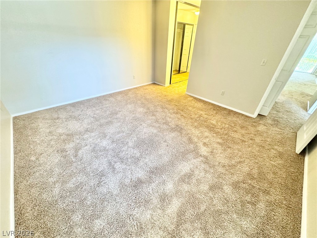 6250 West Flamingo Road, Unit 109 Las Vegas, NV 89103 - Photo 6 of 18 A spacious bedroom awaits, featuring comfortable carpet flooring.