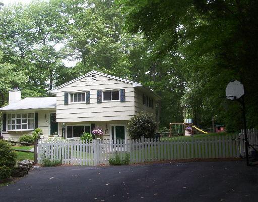 30 Algonquin Road Norwalk, CT 06851 - Photo 1 of 1 a front view of a house with a garden