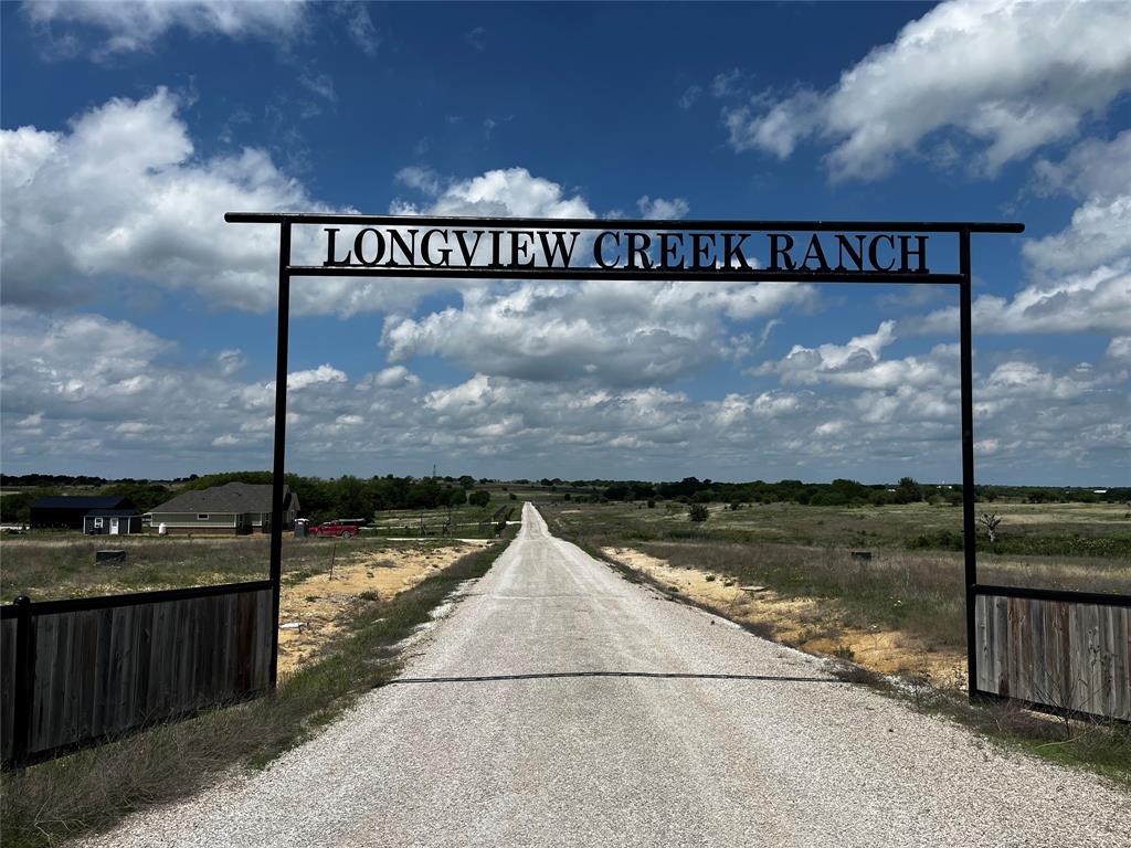 Lot 65 Longview Creek Ranch Trail Itasca, TX 76055 - Photo 4 of 9 a view of a street with a big yard