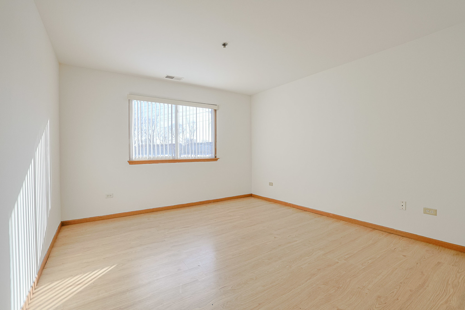 881 North Swift Road, Unit 206 Addison, IL 60101 - Photo 17 of 26 an empty room with a window