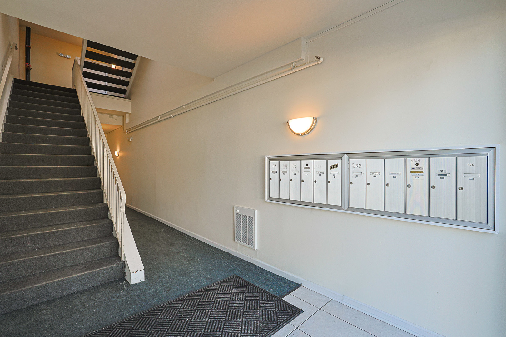 881 North Swift Road, Unit 206 Addison, IL 60101 - Photo 4 of 26 a view of a hallway with staircase