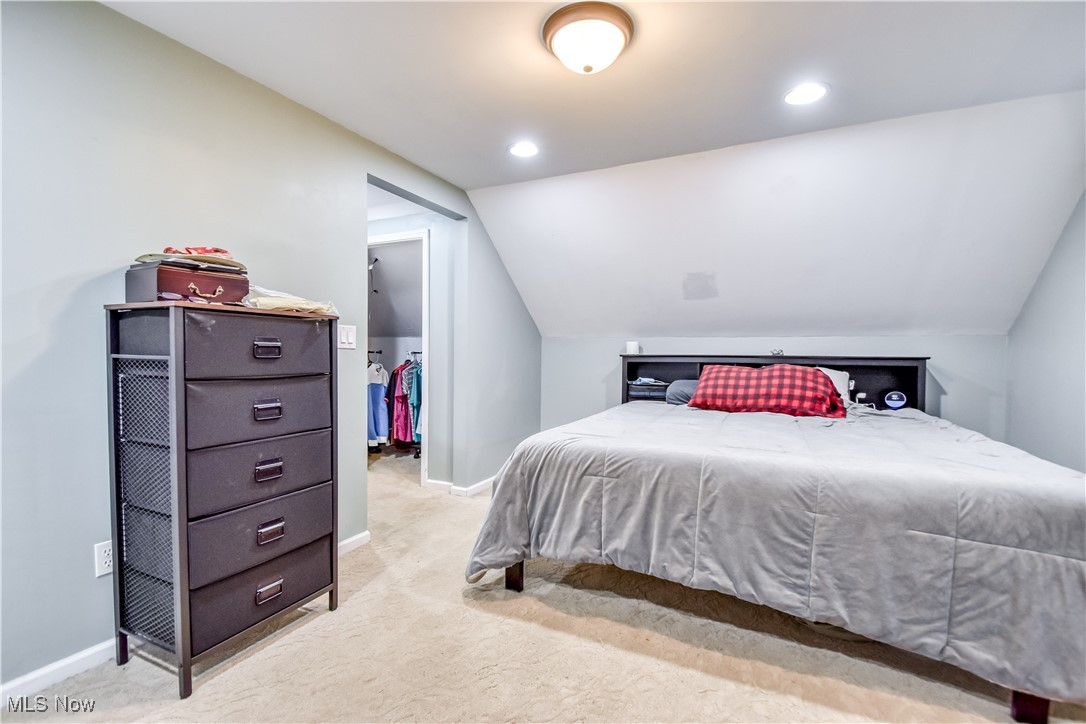 8115 Stockbridge Road Mentor, OH 44060 - Photo 33 of 46 Bedroom featuring vaulted ceiling, light colored carpet, and recessed lighting