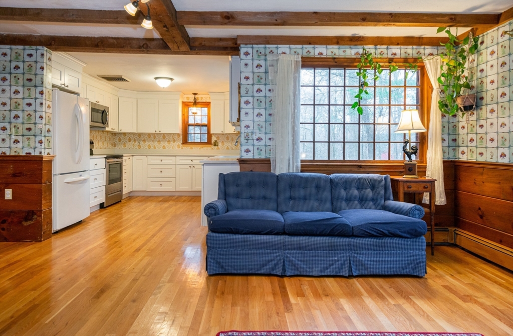 15 Hart Road Lynnfield, MA 01940 - Photo 11 of 40 a living room with furniture and a large window