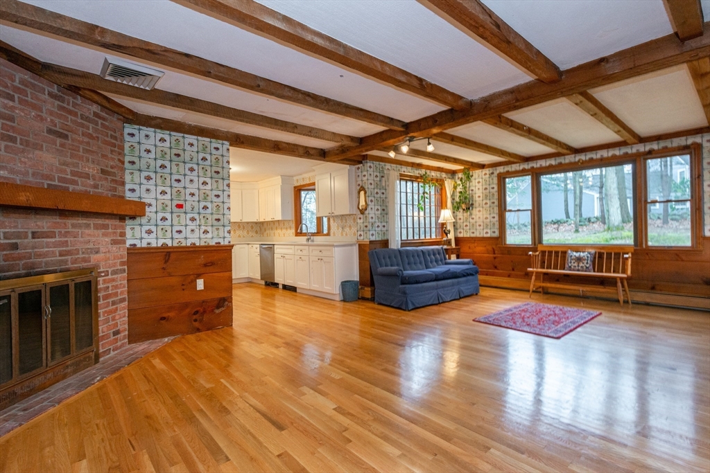 15 Hart Road Lynnfield, MA 01940 - Photo 14 of 40 a living room with furniture and a fireplace