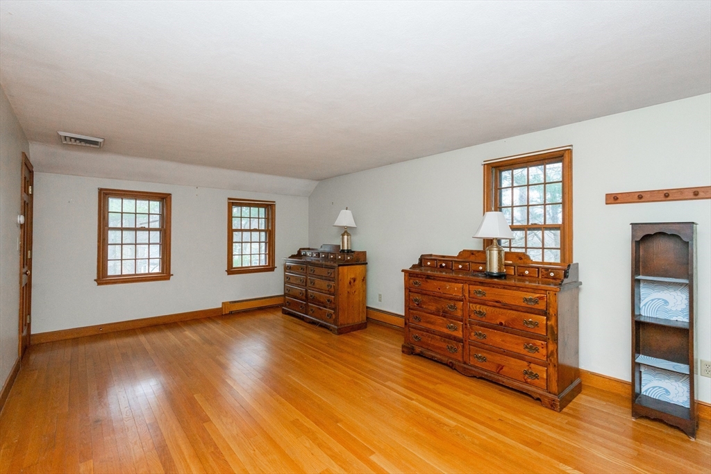15 Hart Road Lynnfield, MA 01940 - Photo 21 of 40 a living room with furniture and a fireplace