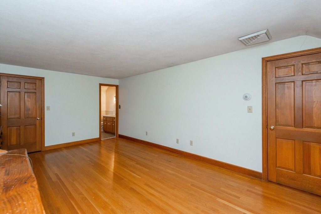 15 Hart Road Lynnfield, MA 01940 - Photo 23 of 40 an empty room with wooden floor closet and windows