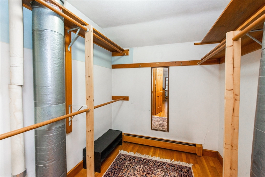 15 Hart Road Lynnfield, MA 01940 - Photo 25 of 40 a view of walk in closet with window and wooden floor