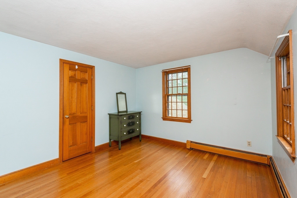 15 Hart Road Lynnfield, MA 01940 - Photo 28 of 40 an empty room with window and wooden floor