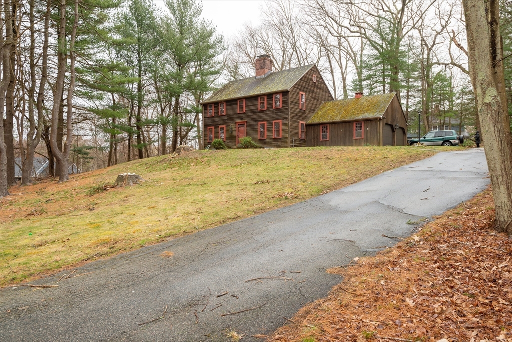 15 Hart Road Lynnfield, MA 01940 - Photo 33 of 40 a front view of a house with a yard and garage