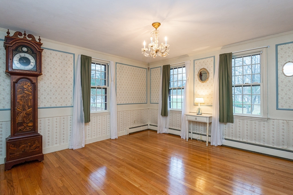 15 Hart Road Lynnfield, MA 01940 - Photo 7 of 40 a bedroom with a bed and a large window