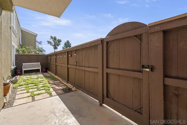 a view of a house with a chairs in a patio