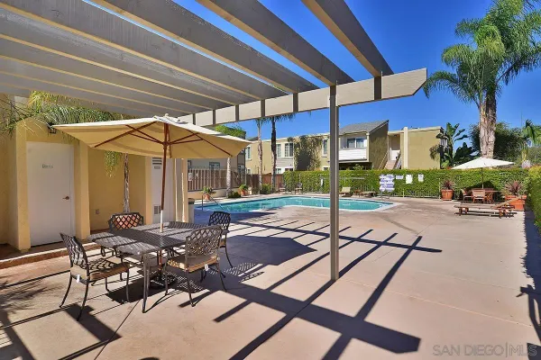 a view of a swimming pool with chairs