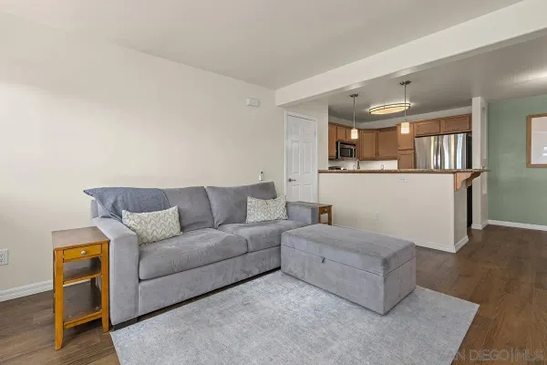 an empty room with wooden floor and a window