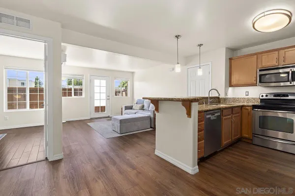 a kitchen with a sink stove and refrigerator