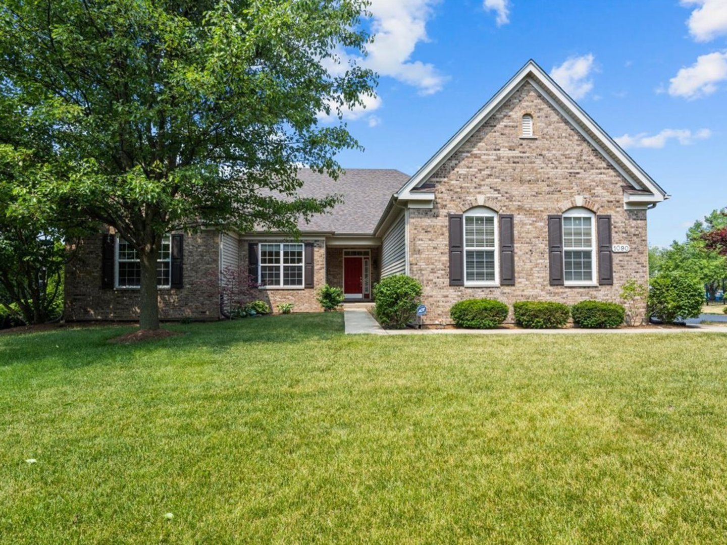 a view of a house with a yard