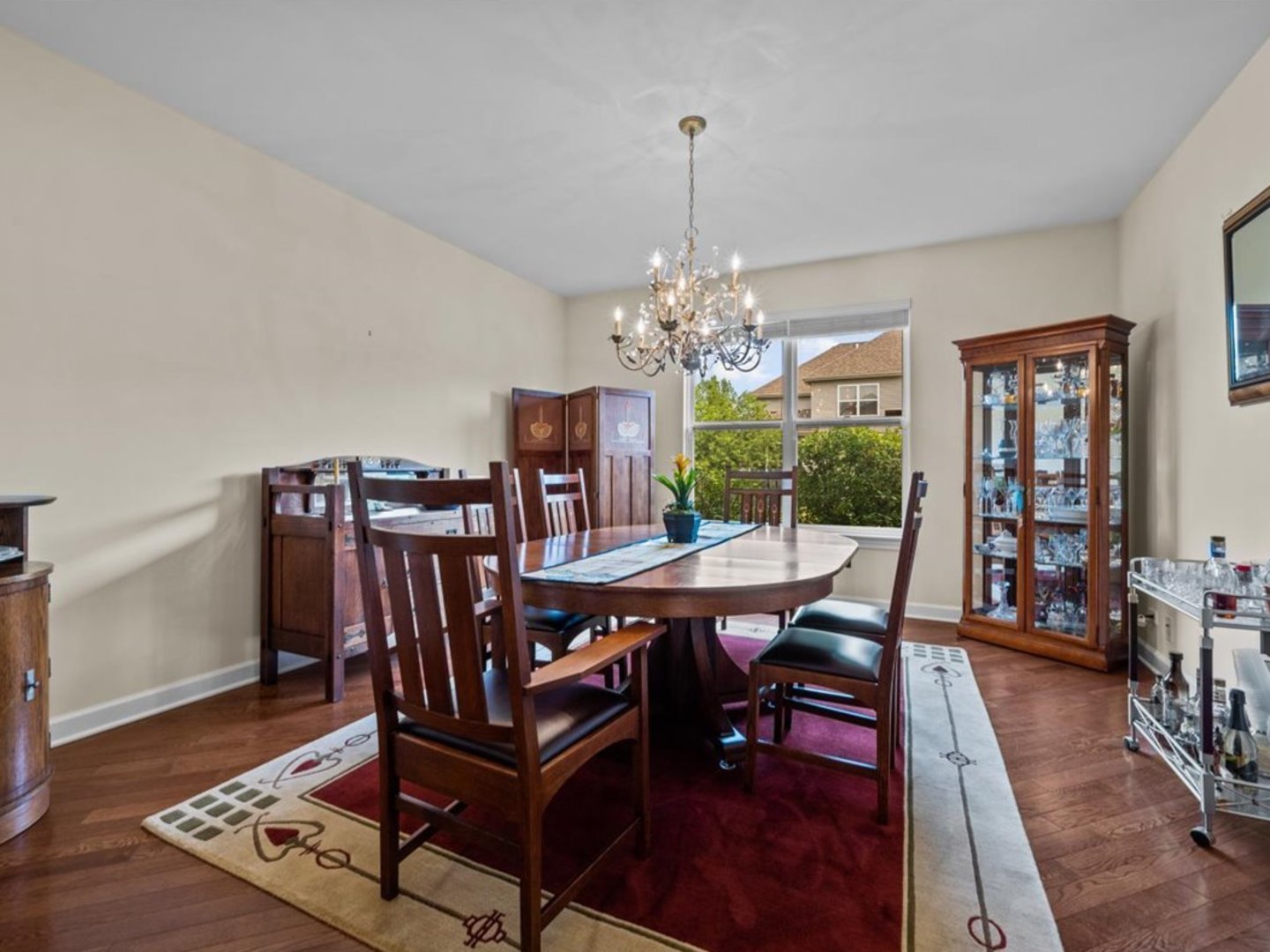 1090 Deerpath Road Aurora, IL 60506 - Photo 12 of 28 a view of a dining room with furniture a rug and wooden floor