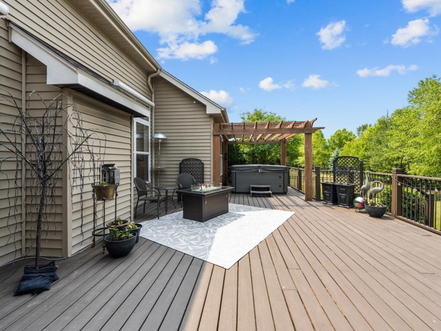 1090 Deerpath Road Aurora, IL 60506 - Photo 23 of 28 a view of a patio with dining table and chairs with wooden floor