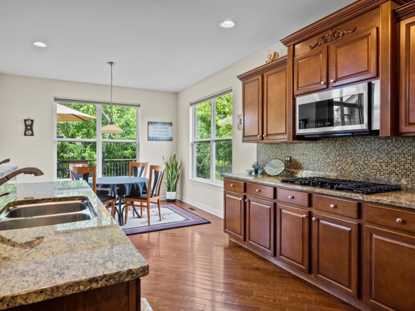 1090 Deerpath Road Aurora, IL 60506 - Photo 8 of 28 a kitchen with stainless steel appliances granite countertop a stove a sink and a microwave