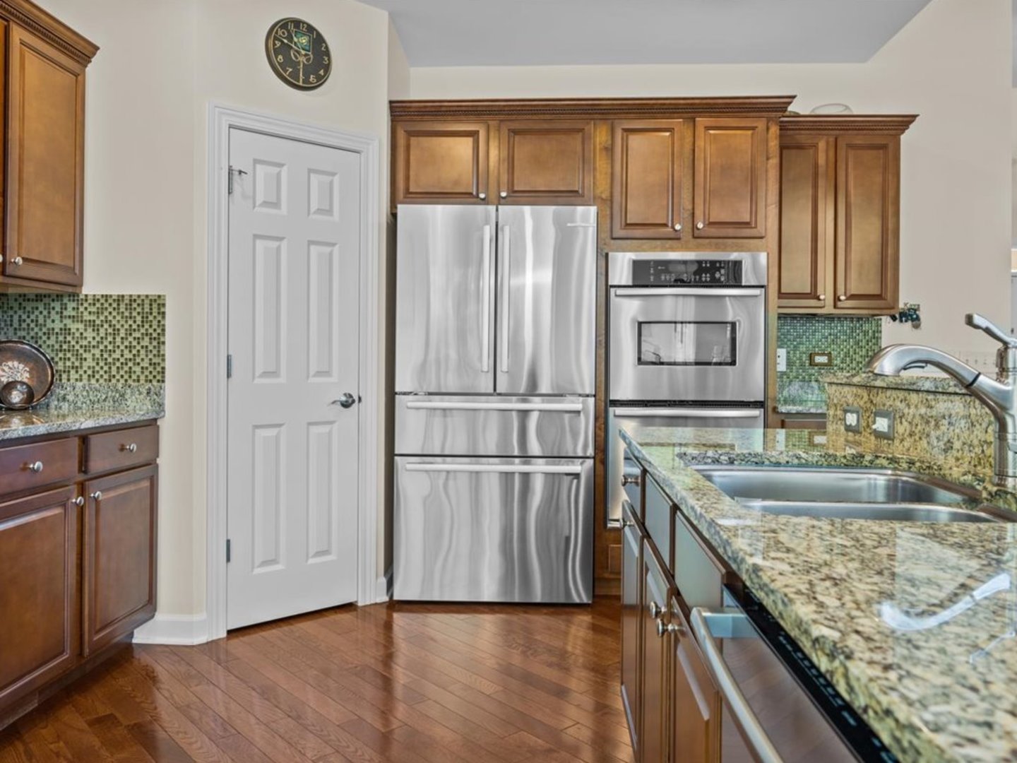 1090 Deerpath Road Aurora, IL 60506 - Photo 9 of 28 a kitchen with kitchen island granite countertop a refrigerator oven a sink dishwasher and wooden cabinets with wooden floor