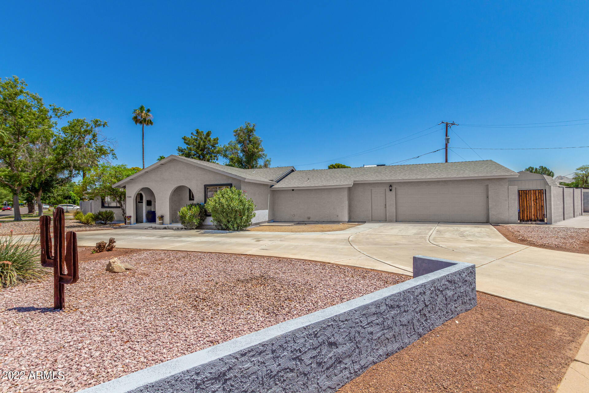 7201 North 16th Drive Phoenix, AZ 85021 - Photo 1 of 29 a front view of a house with a yard