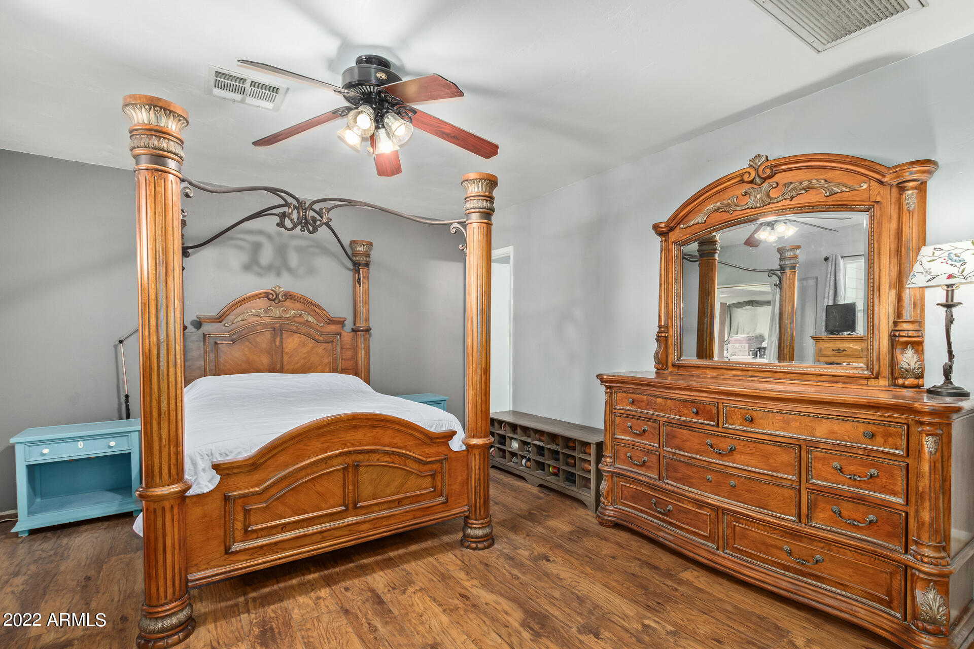 7201 North 16th Drive Phoenix, AZ 85021 - Photo 13 of 29 a bedroom with a bed and a chandelier