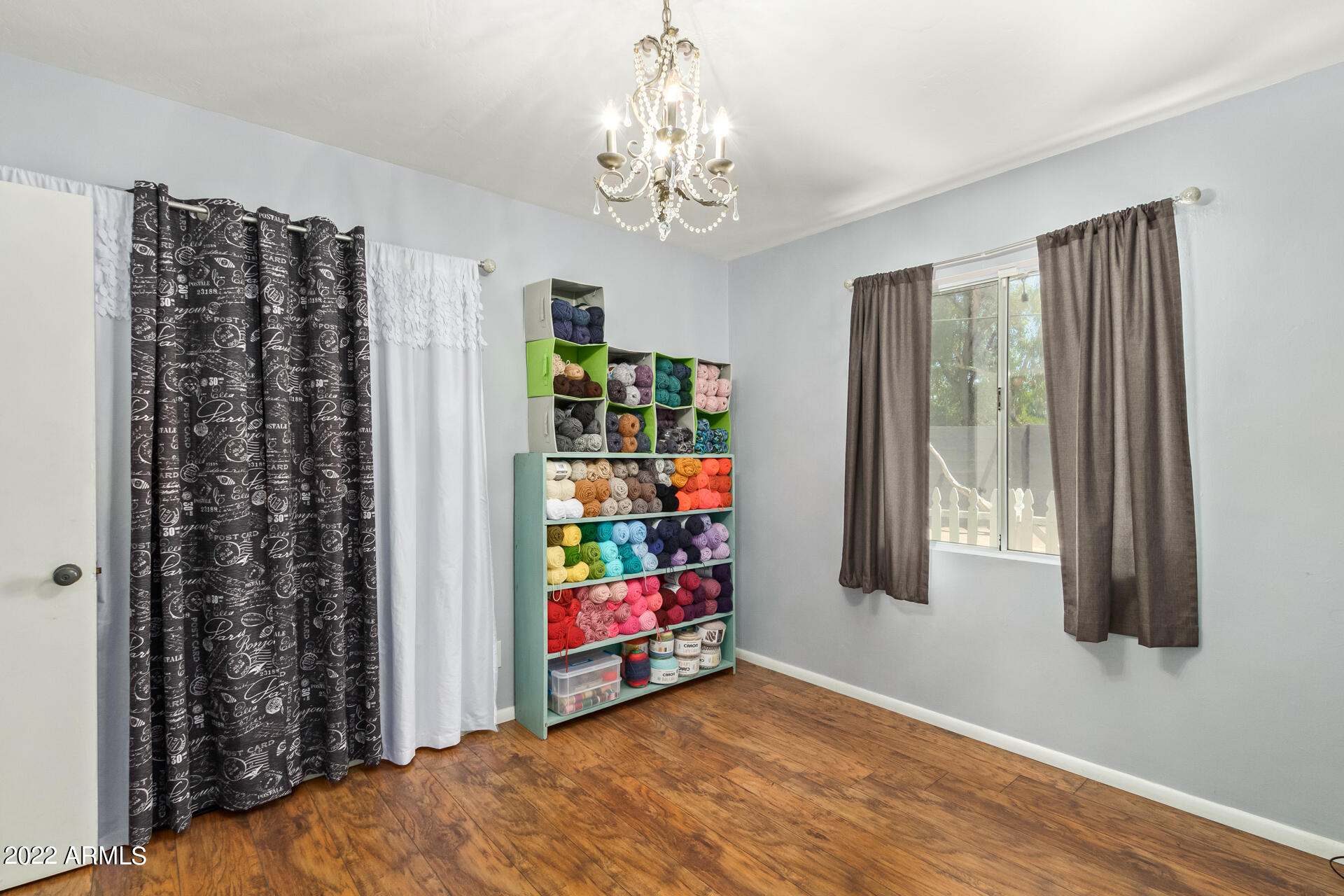 7201 North 16th Drive Phoenix, AZ 85021 - Photo 19 of 29 a view of a bedroom with window and furniture
