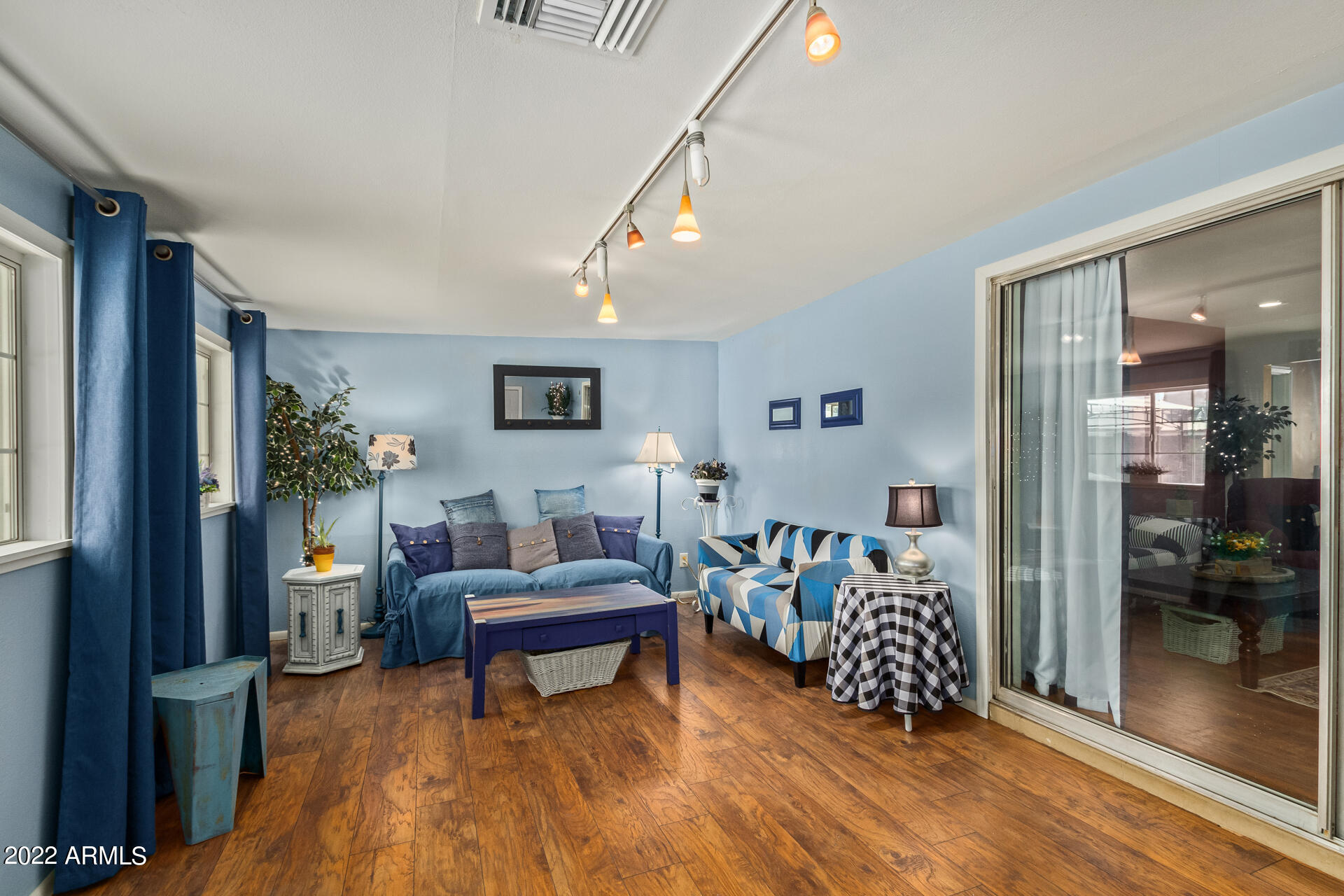 7201 North 16th Drive Phoenix, AZ 85021 - Photo 20 of 29 a living room with furniture and wooden floor