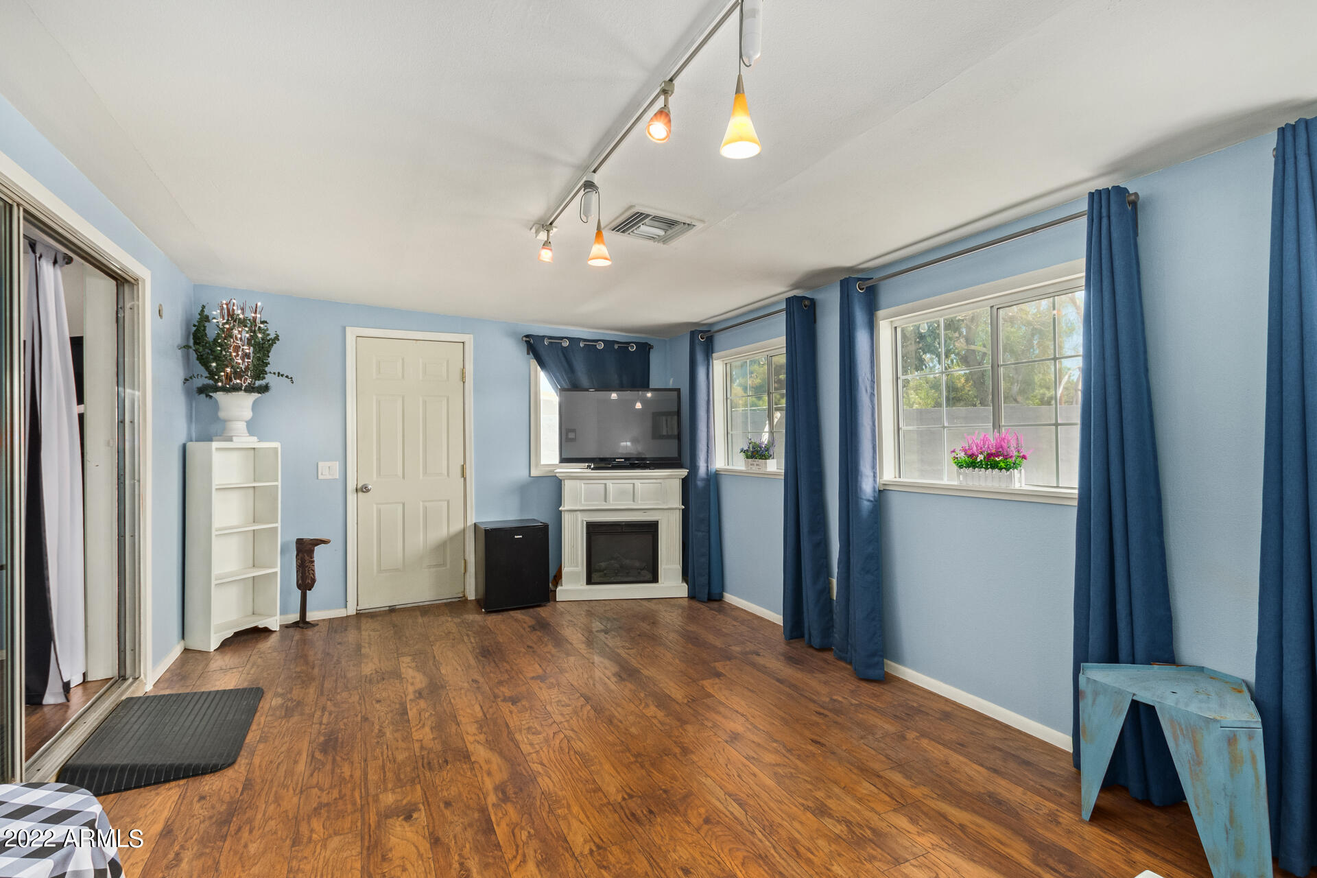 7201 North 16th Drive Phoenix, AZ 85021 - Photo 21 of 29 a bedroom with a bed and a flat screen tv