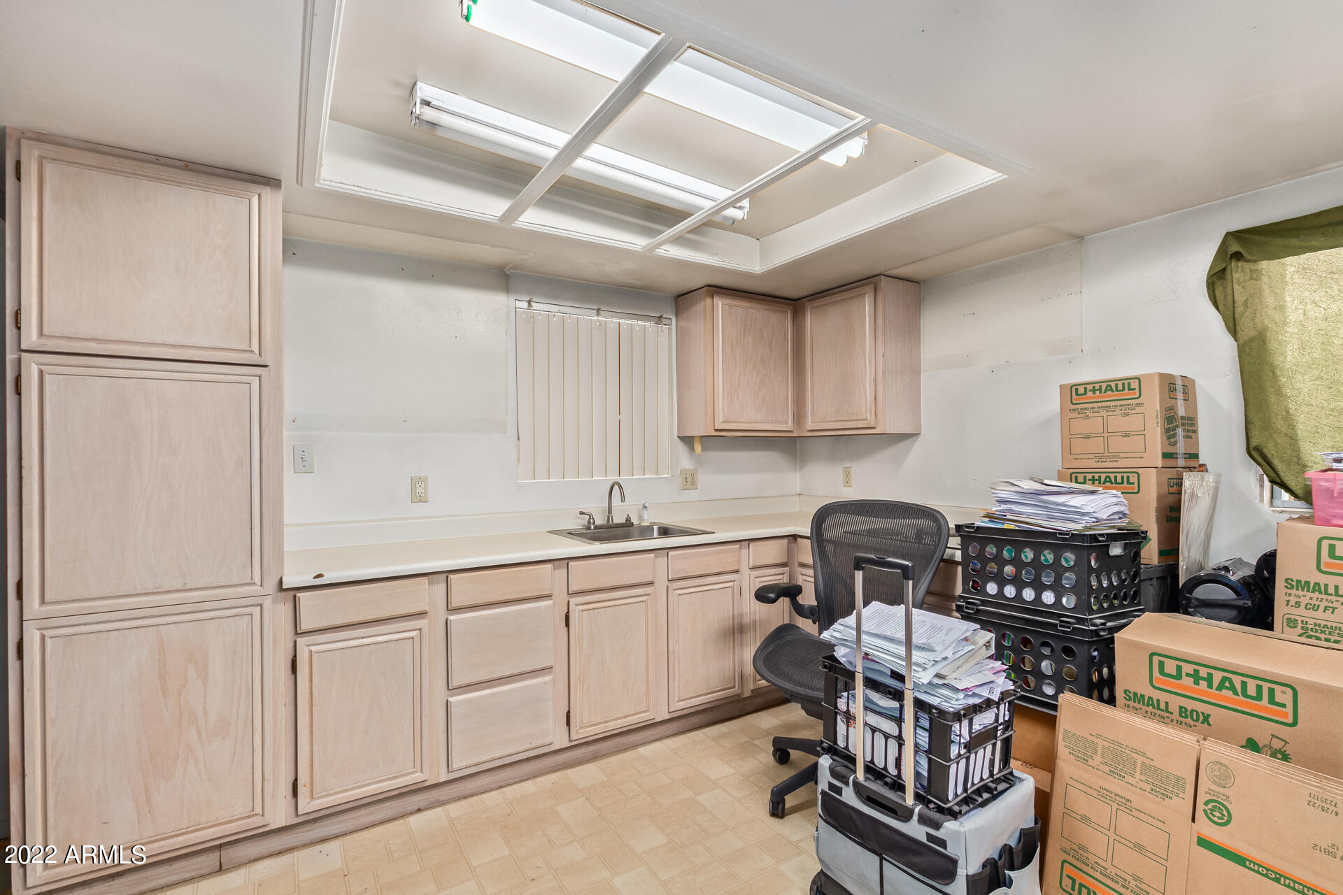 7201 North 16th Drive Phoenix, AZ 85021 - Photo 23 of 29 a kitchen with stainless steel appliances granite countertop a sink stove and refrigerator