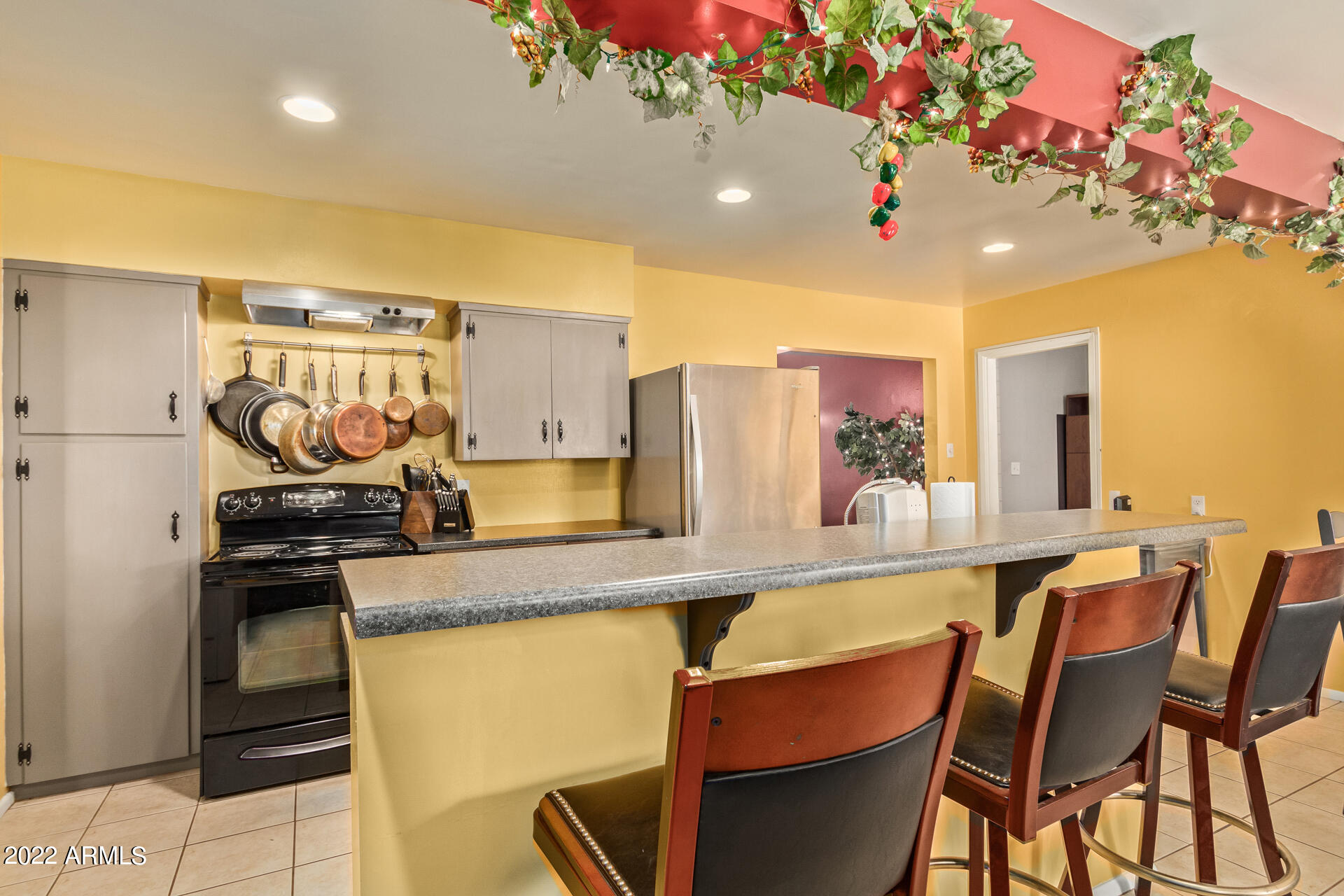 7201 North 16th Drive Phoenix, AZ 85021 - Photo 8 of 29 a kitchen with stainless steel appliances granite countertop a sink and cabinets