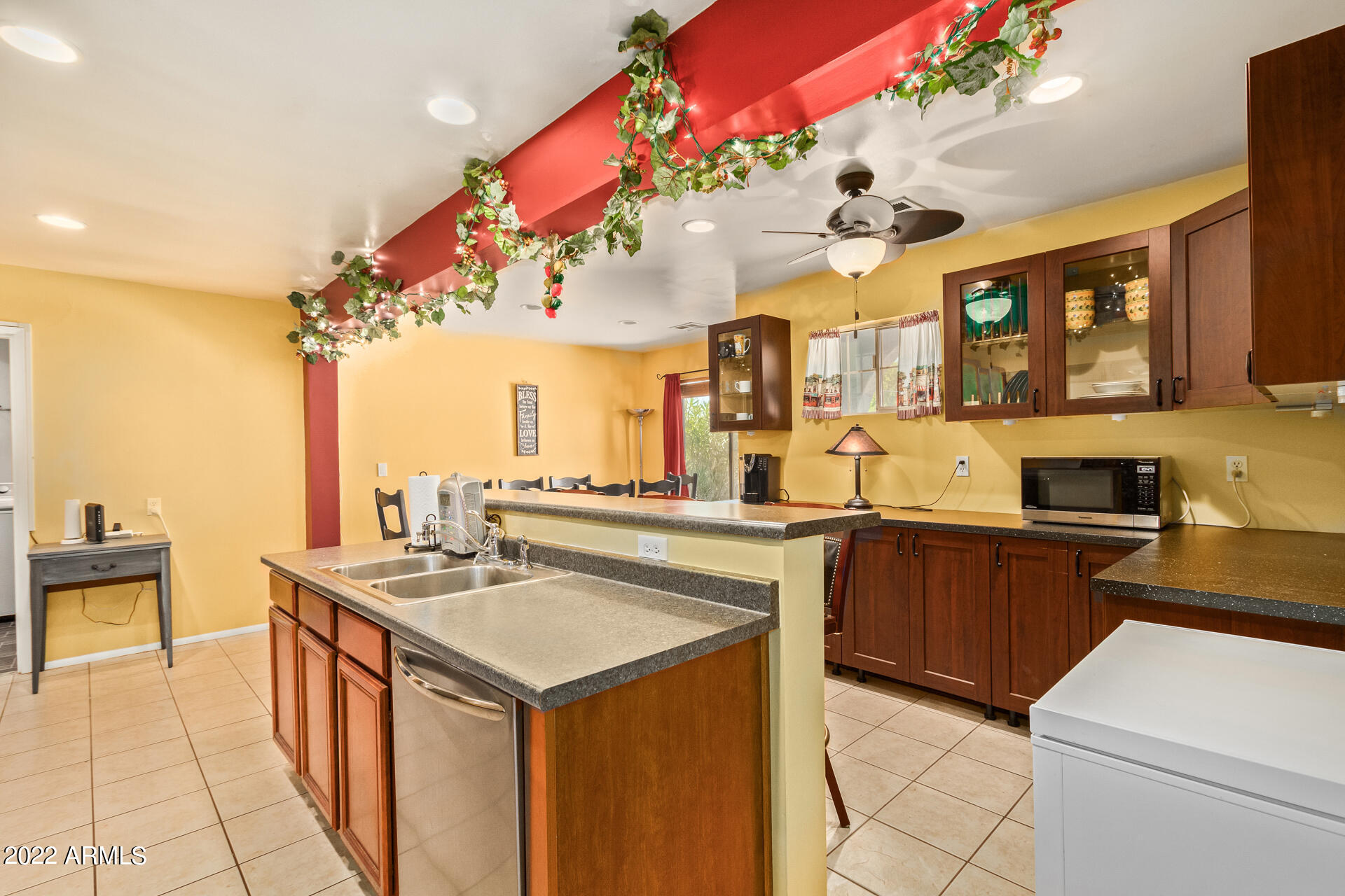 7201 North 16th Drive Phoenix, AZ 85021 - Photo 10 of 29 a kitchen with a sink stove and cabinets