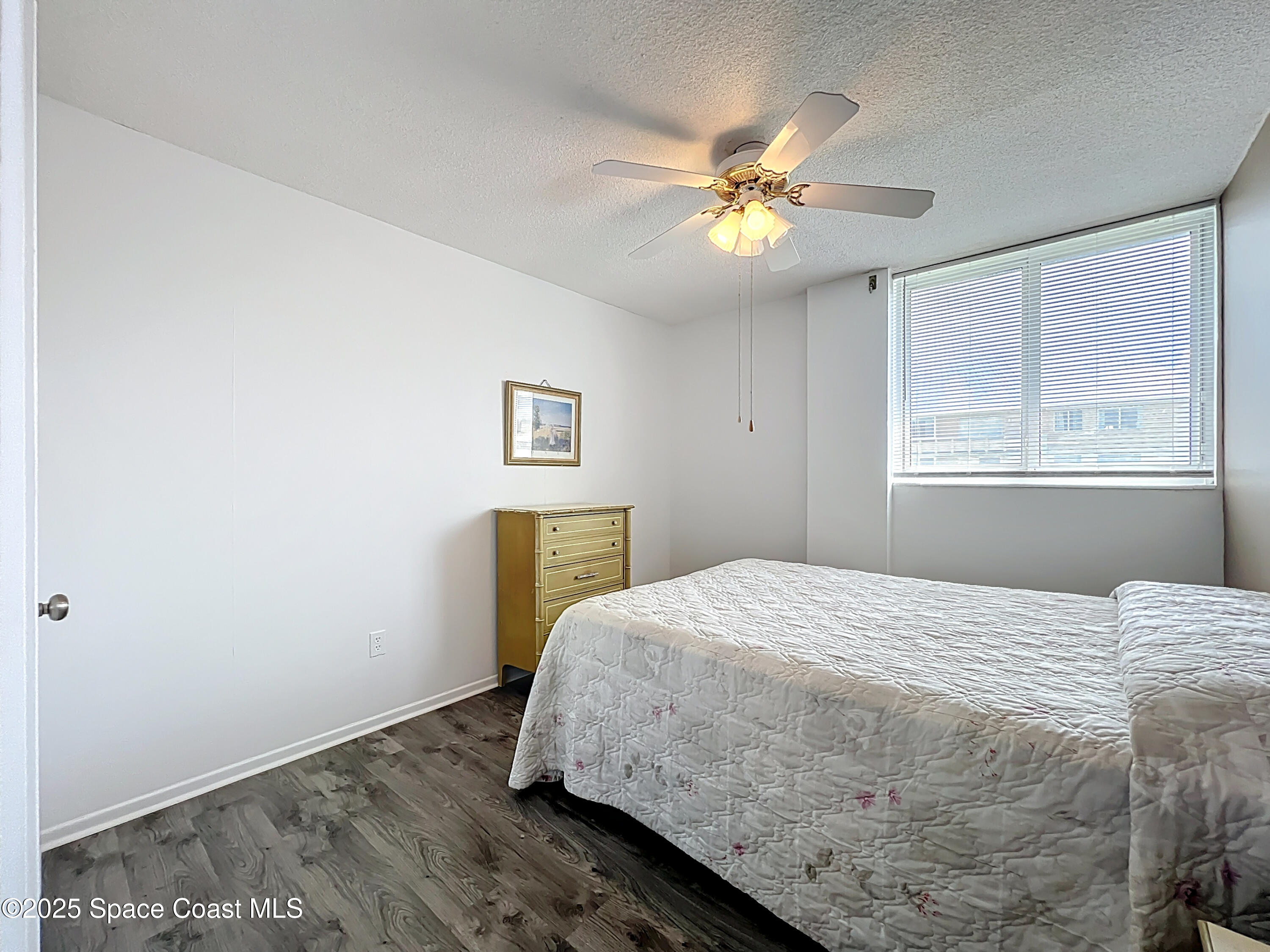 2020 North Atlantic Avenue, Unit 514N Cocoa Beach, FL 32931 - Photo 12 of 31 a bedroom with a bed and a window