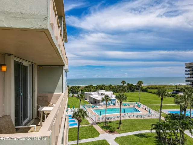 a view of a kitchen with stainless steel appliances
