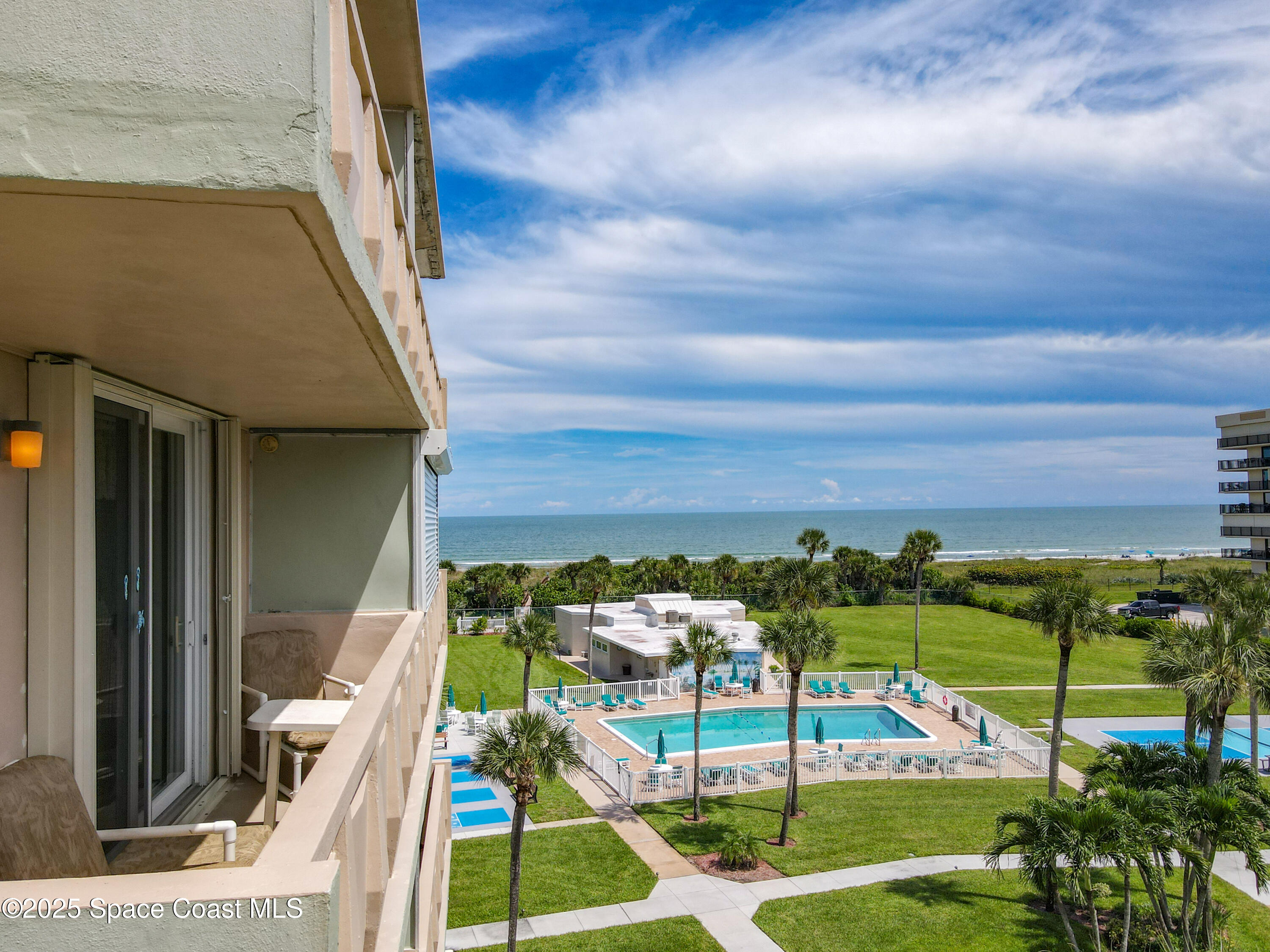 2020 North Atlantic Avenue, Unit 514N Cocoa Beach, FL 32931 - Photo 20 of 31 a view of a balcony with yard