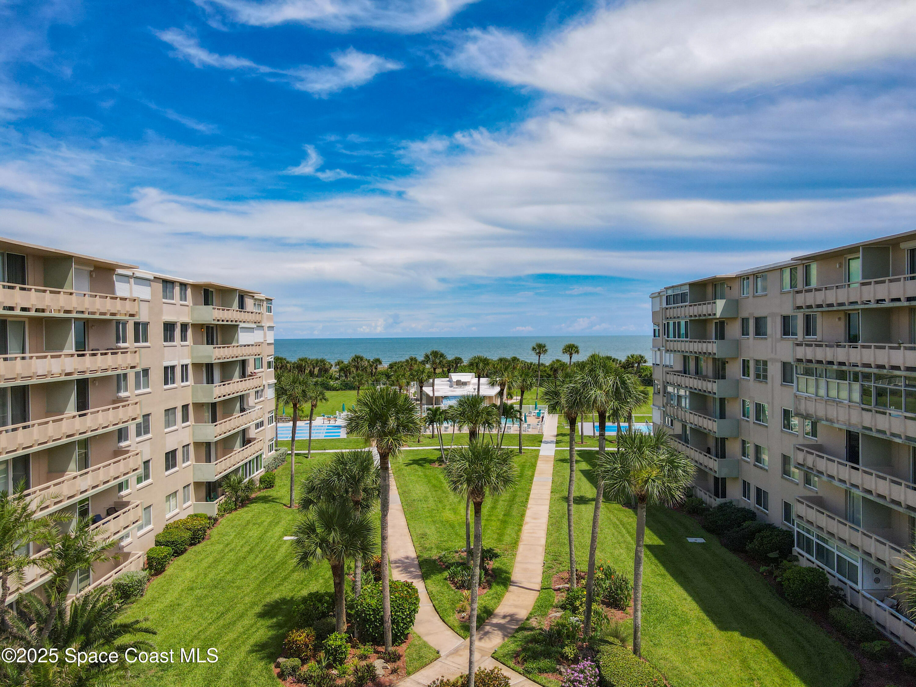 2020 North Atlantic Avenue, Unit 514N Cocoa Beach, FL 32931 - Photo 2 of 31 a view of building with outdoor space