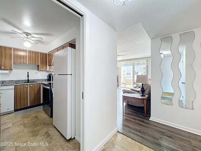 a kitchen with stainless steel appliances granite countertop a sink a stove and cabinets