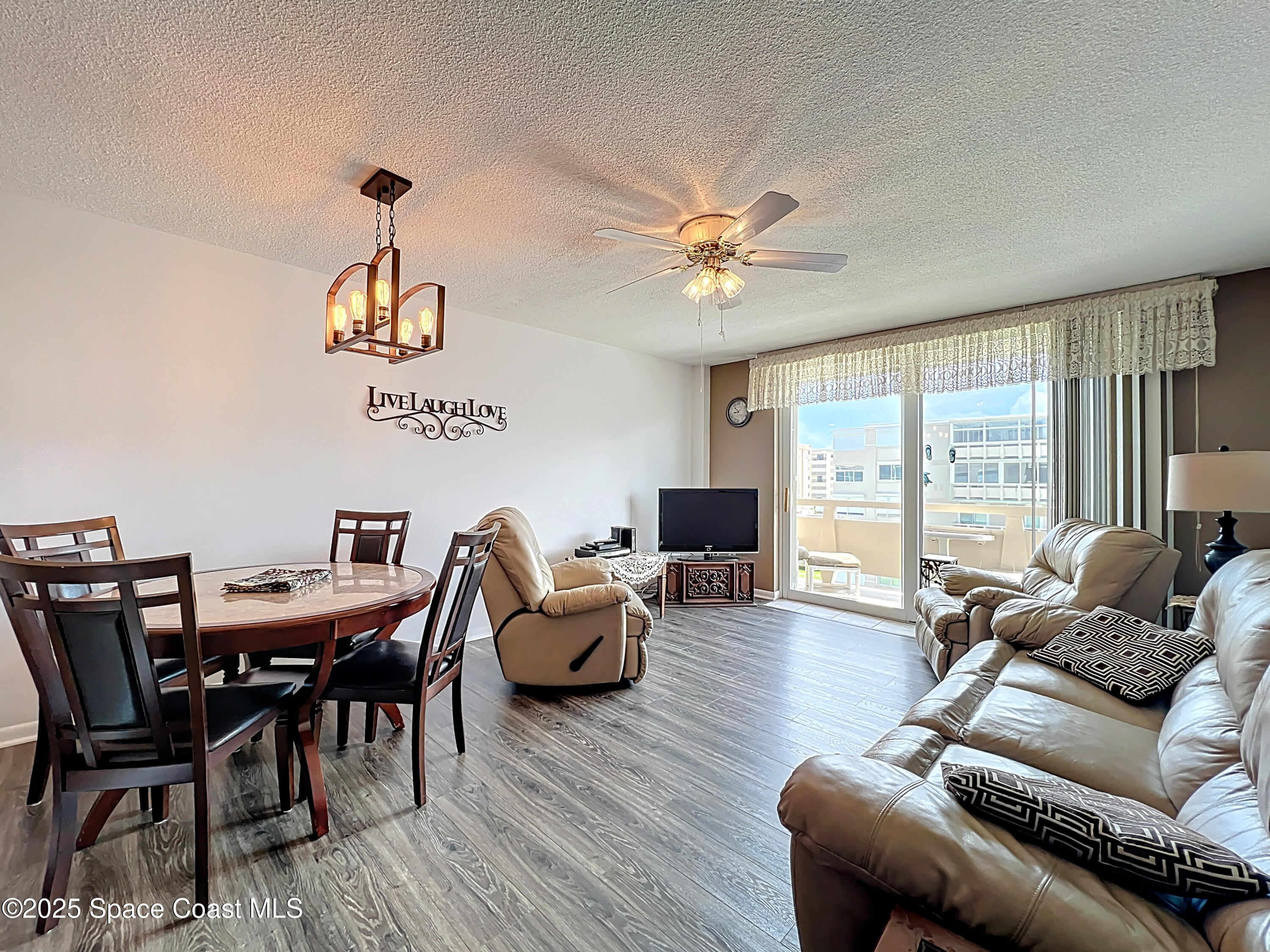 2020 North Atlantic Avenue, Unit 514N Cocoa Beach, FL 32931 - Photo 7 of 31 a living room with furniture and wooden floor