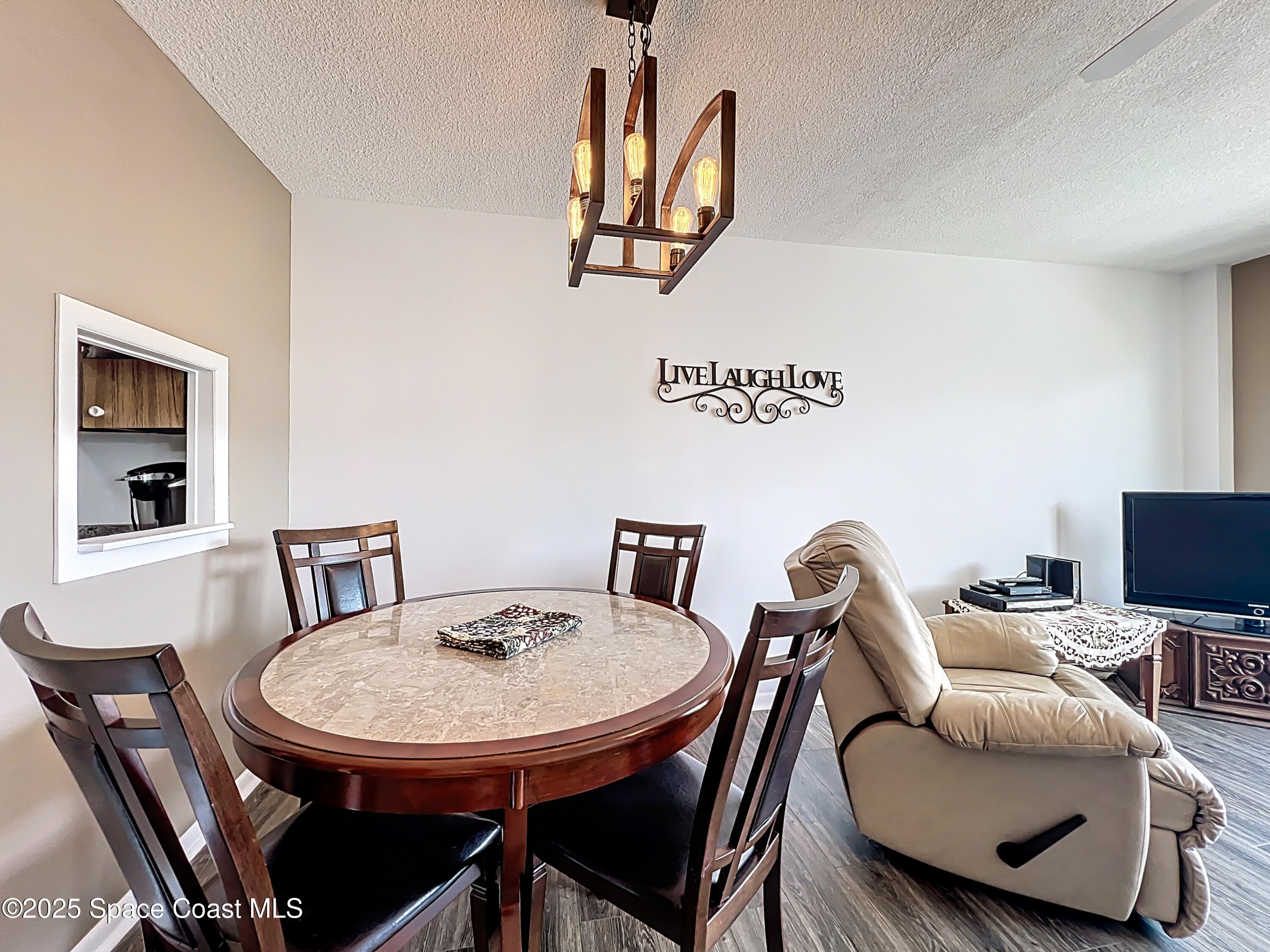 2020 North Atlantic Avenue, Unit 514N Cocoa Beach, FL 32931 - Photo 8 of 31 a view of a dining room with furniture
